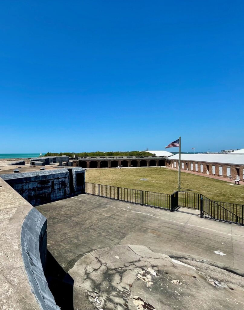 Views of the American Flag flying at Fort Zachary Taylor State Park in Key West.