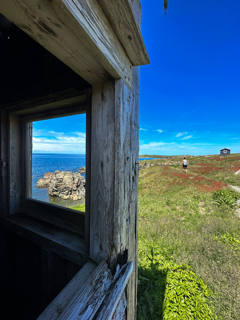 A hiker walking along the Cape Shore Trail.