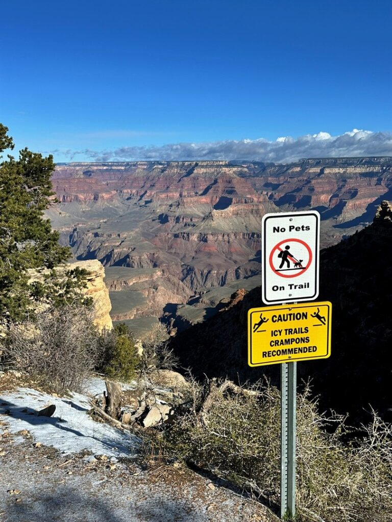 No pets on the trail and icy trails sign on the South Kaibab Trail at the Grand Canyon.