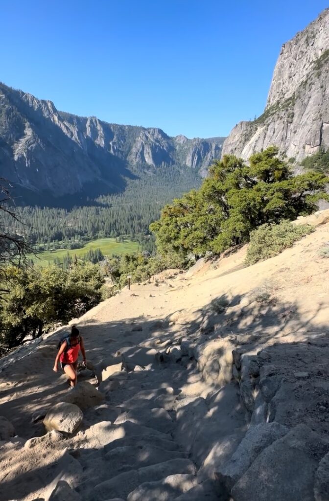A hiker heads up the switchbacks at Yosemite National Park - Upper Falls