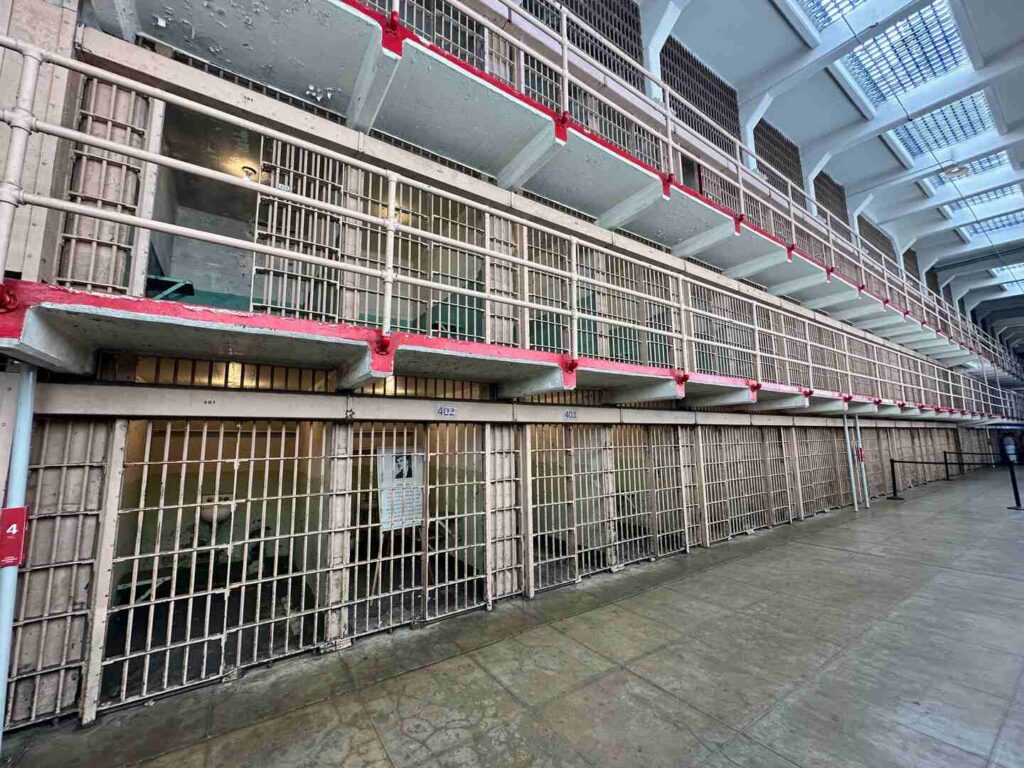 A view of a long row of prison cells inside the Alcatraz Cellhouse