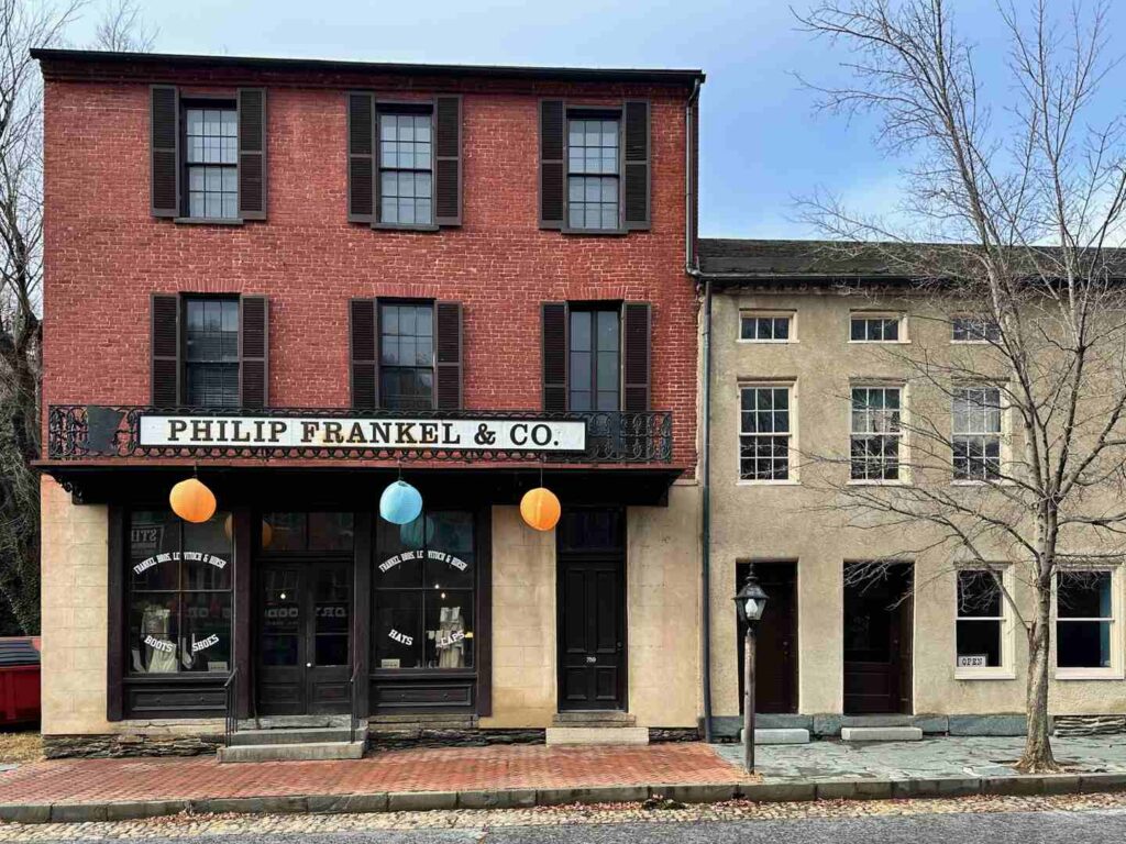 The Philip Frankel & Co building with an old clothing shop exhibit.