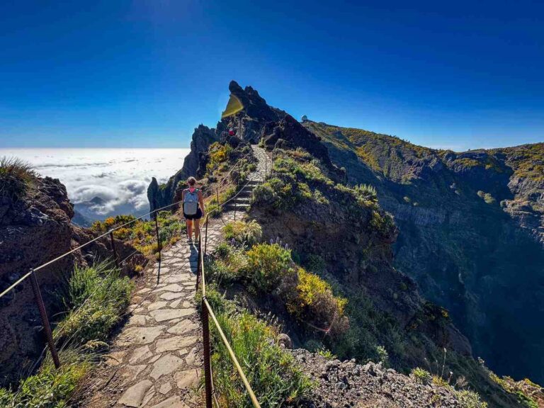 A hiker stands before the stairway to heaven on the PR1 trail in Madeira.