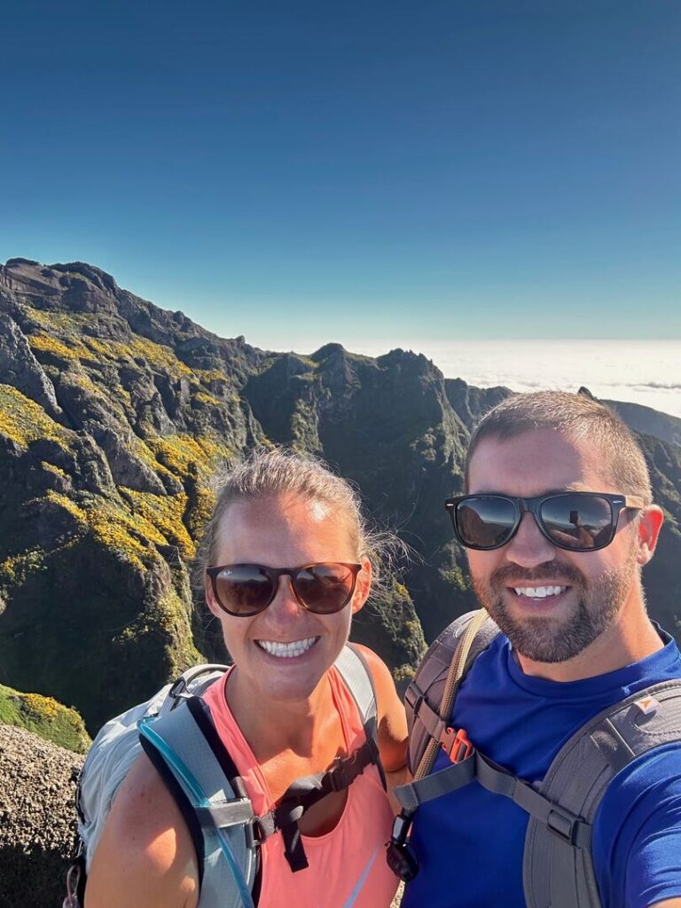 Two hikers pose for a selfie along the trail.