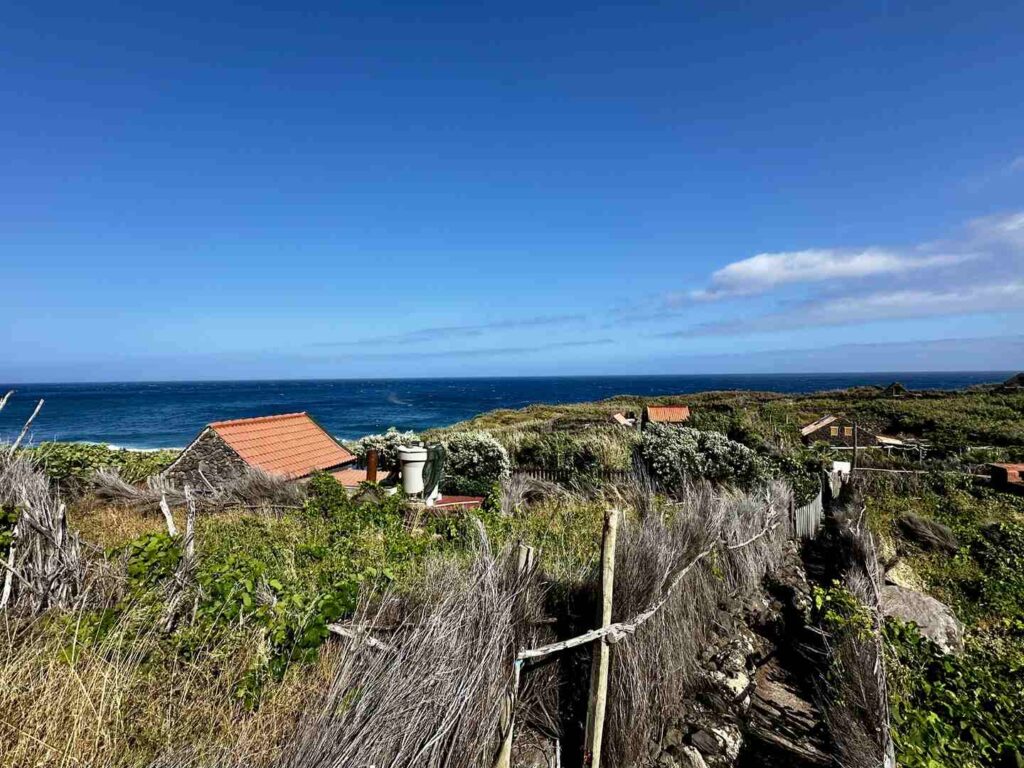 A view of the abandoned village from a small path overlooking the ocean.